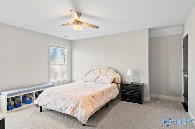 bedroom with ceiling fan, carpet, and baseboards