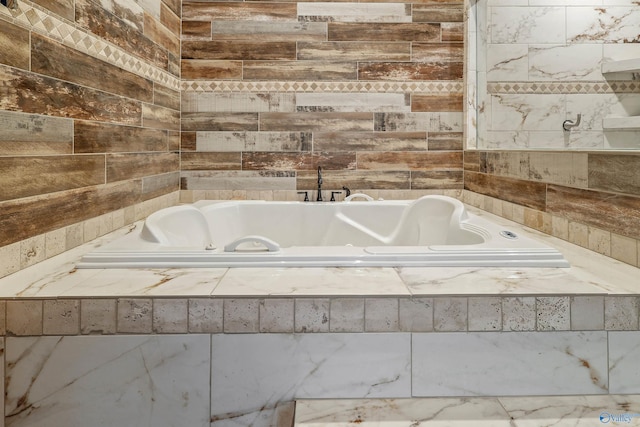 bathroom featuring a relaxing tiled tub