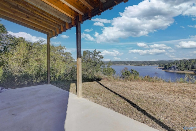 view of patio with a water view