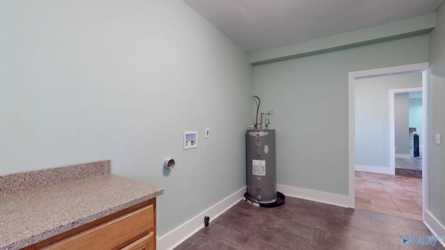 washroom featuring hookup for a washing machine, baseboards, and electric water heater