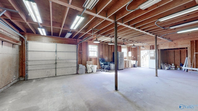 garage with freestanding refrigerator