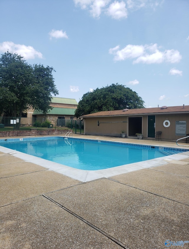 view of swimming pool with a patio