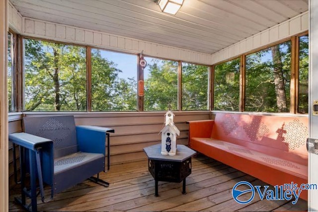 sunroom / solarium featuring wood ceiling