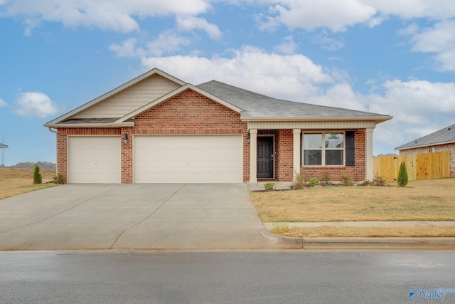 183 Tobin Ln, Hazel Green, AL 35750 - view of front of property with brick siding, driveway, an attached garage, and a shingled roof