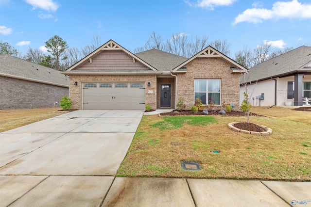 view of front facade featuring brick siding, concrete driveway, a front yard, roof with shingles, and a garage