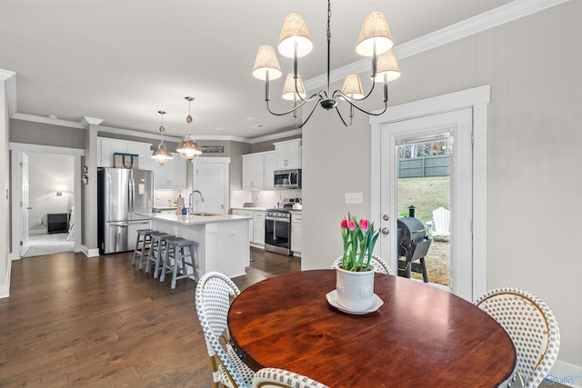 dining room featuring a chandelier, baseboards, ornamental molding, and dark wood-style flooring