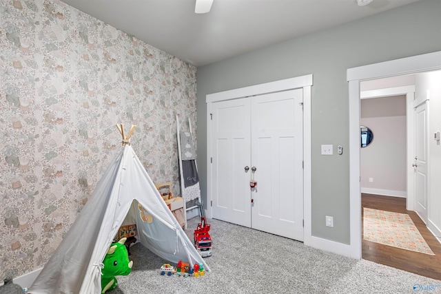 game room with wallpapered walls, carpet, and baseboards