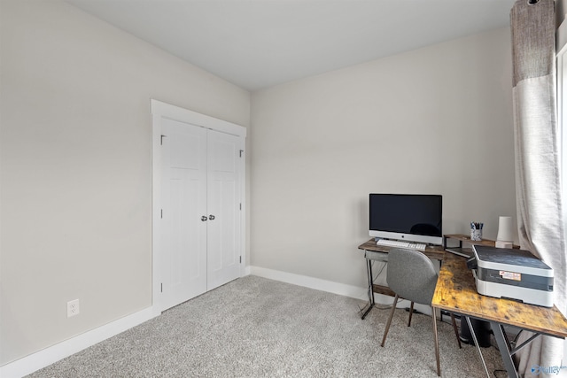 office featuring baseboards and carpet floors