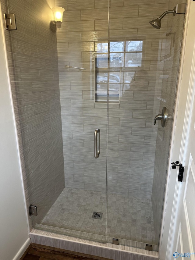 bathroom featuring an enclosed shower