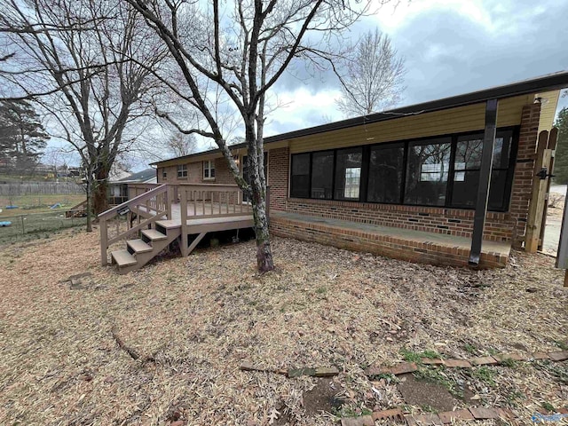 back of property with a deck