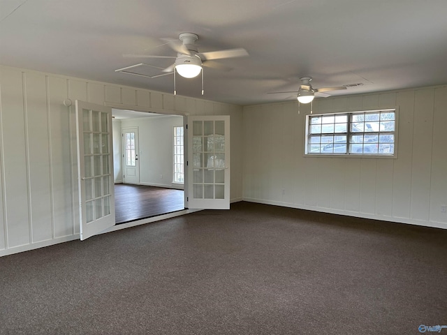 empty room with a wealth of natural light and ceiling fan