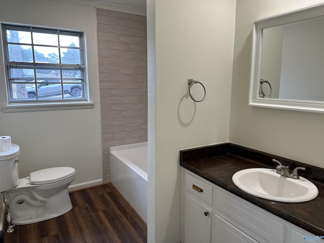 bathroom with hardwood / wood-style flooring, vanity, and toilet