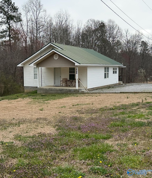 view of front of home with metal roof and covered porch