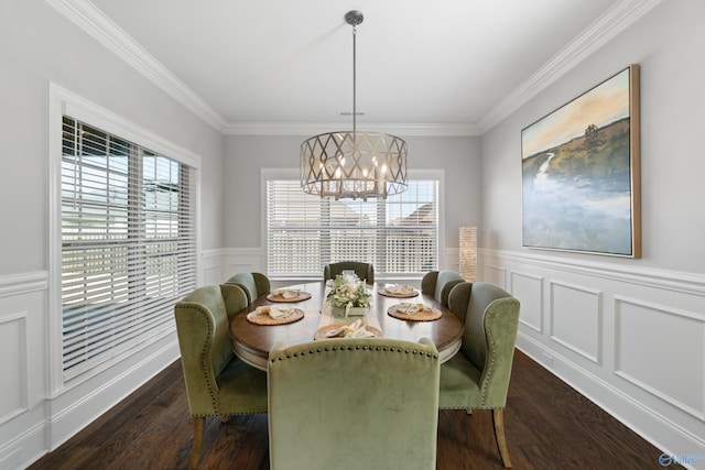 dining space with an inviting chandelier, dark wood-style floors, and crown molding