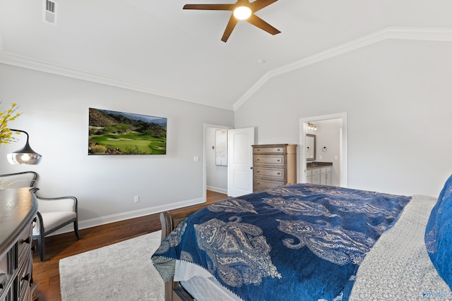 bedroom featuring visible vents, connected bathroom, vaulted ceiling, wood finished floors, and baseboards