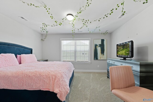 bedroom featuring carpet, visible vents, and baseboards