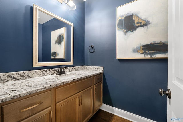 bathroom with baseboards and vanity