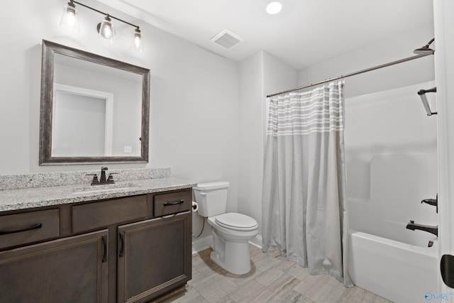 full bathroom featuring visible vents, vanity, toilet, and shower / bathtub combination with curtain