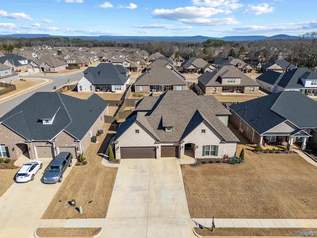 birds eye view of property featuring a mountain view and a residential view