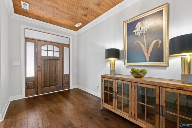 foyer with dark wood-style flooring, visible vents, ornamental molding, wooden ceiling, and baseboards