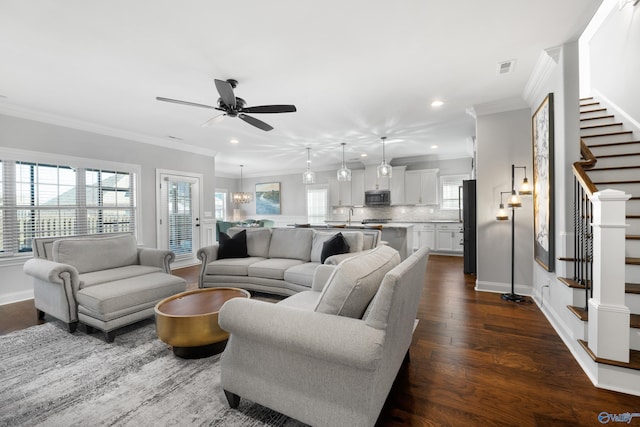 living area with dark wood-style floors, ornamental molding, stairway, and baseboards