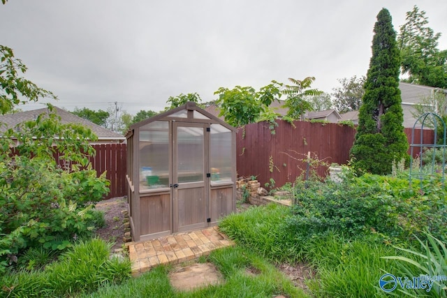 717 NE Eustis Ave, Huntsville, AL 35801 - view of greenhouse featuring a fenced backyard