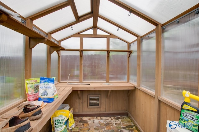 717 NE Eustis Ave, Huntsville, AL 35801 - sunroom with lofted ceiling and stone finish flooring