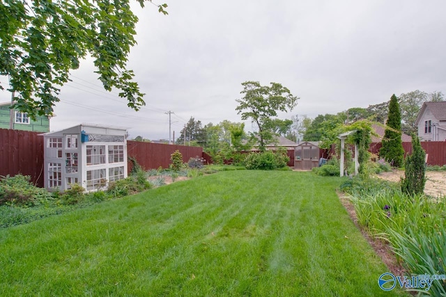 717 NE Eustis Ave, Huntsville, AL 35801 - view of yard featuring a storage shed and an outdoor structure