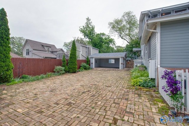 717 NE Eustis Ave, Huntsville, AL 35801 - view of patio with fence and decorative driveway