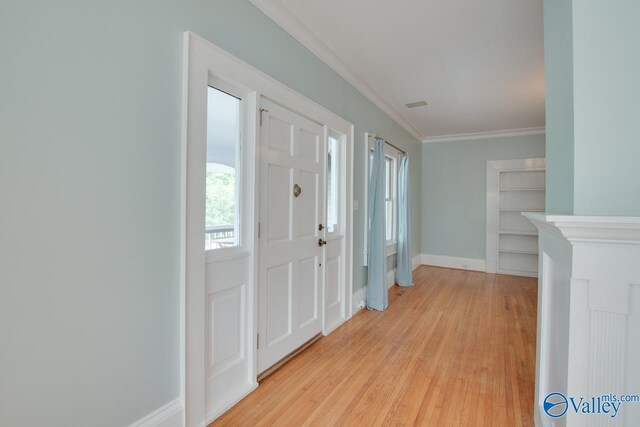 717 NE Eustis Ave, Huntsville, AL 35801 - foyer entrance featuring ornamental molding, light wood-style floors, and baseboards