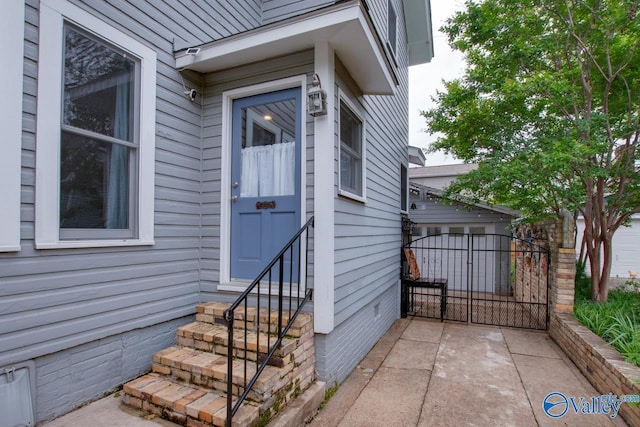 717 NE Eustis Ave, Huntsville, AL 35801 - doorway to property featuring a gate and crawl space