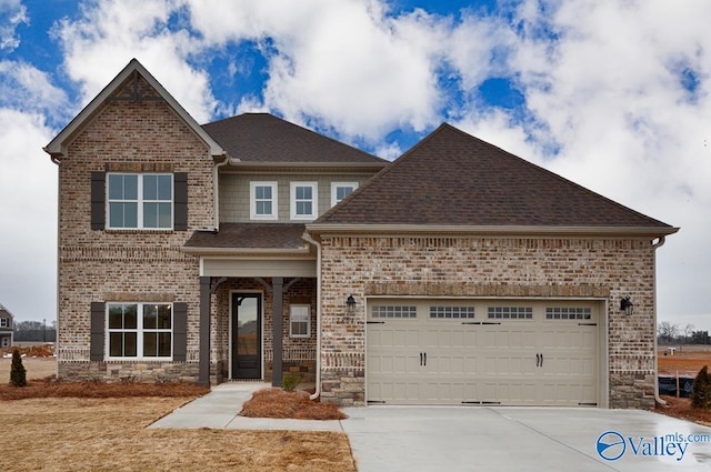 craftsman-style house with brick siding, driveway, an attached garage, and roof with shingles