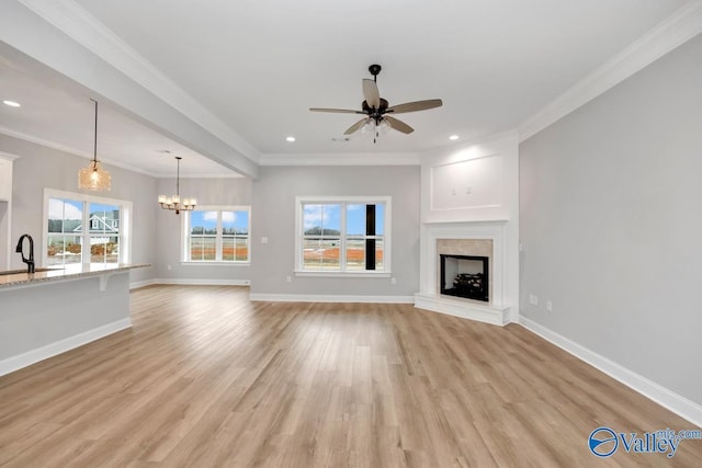 unfurnished living room featuring a fireplace with raised hearth, light wood-style flooring, and baseboards