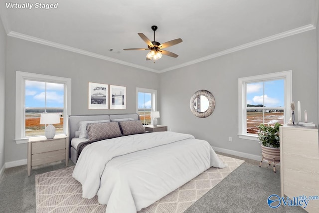 bedroom featuring light carpet, multiple windows, and baseboards