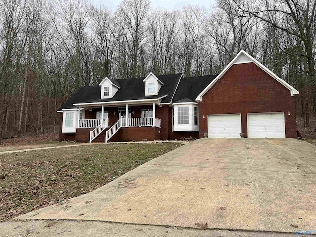 view of front of house featuring a garage and a porch