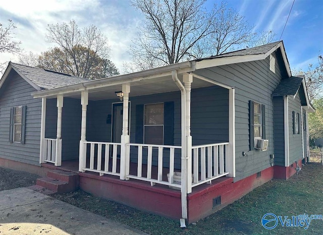 view of front of house featuring cooling unit and covered porch