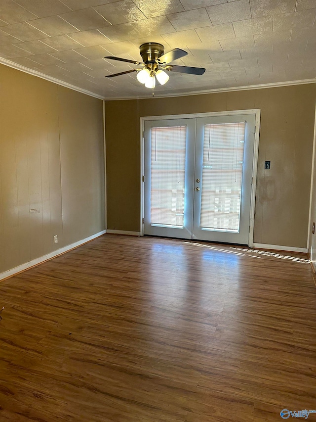 unfurnished room with ceiling fan, french doors, dark hardwood / wood-style floors, and ornamental molding