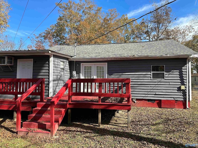 back of property with french doors and a deck