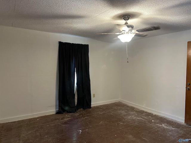 spare room featuring ceiling fan and a textured ceiling