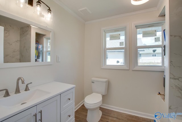 full bathroom featuring toilet, vanity, crown molding, and wood finished floors