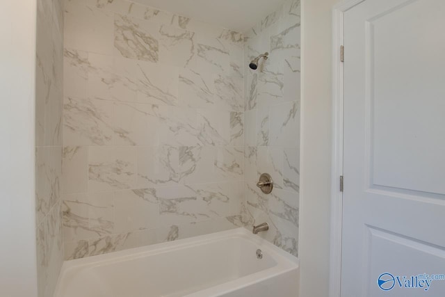 bathroom with bathing tub / shower combination