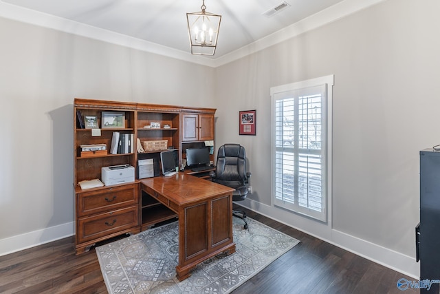 home office featuring dark hardwood / wood-style floors, crown molding, and an inviting chandelier