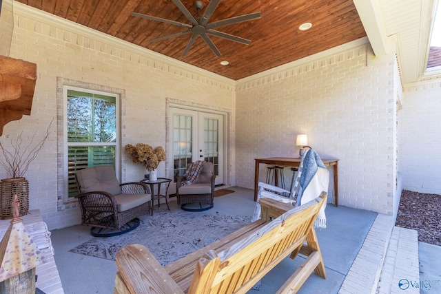 view of patio featuring ceiling fan, french doors, and an outdoor living space