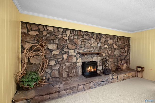 details with crown molding, carpet flooring, a textured ceiling, and a stone fireplace