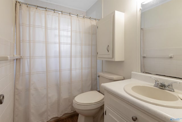 bathroom with crown molding, vanity, a shower with curtain, and toilet