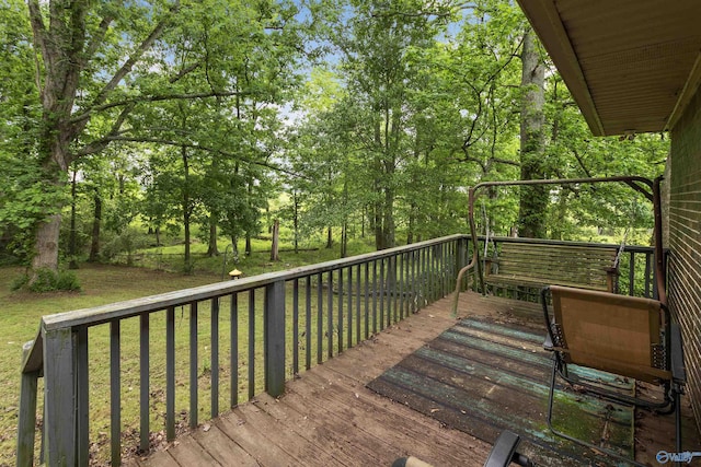 deck featuring a lawn