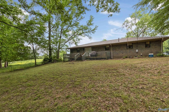 view of yard with a wooden deck
