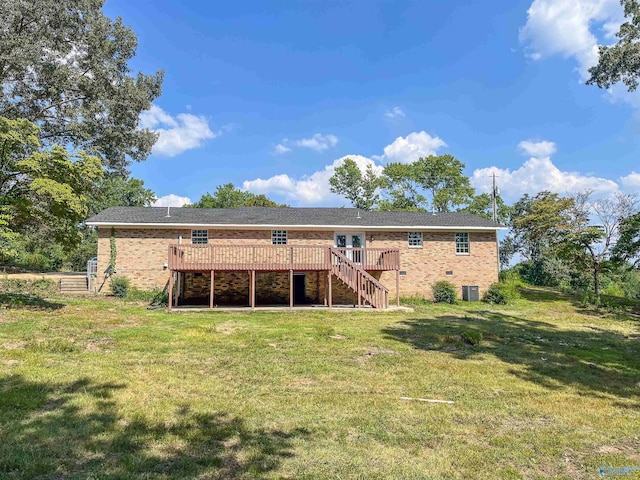 rear view of property featuring cooling unit, a yard, and a deck