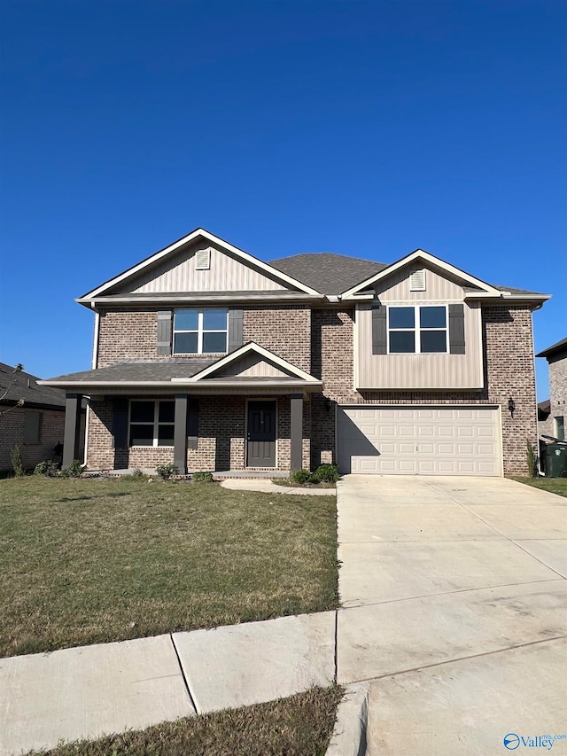 view of front facade with a front yard and a garage