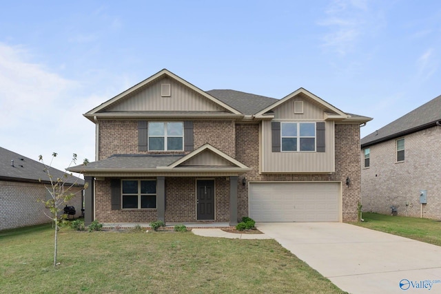 116 Coco Cir, Hazel Green, AL 35750 - view of front of house featuring a garage, concrete driveway, board and batten siding, a front yard, and brick siding